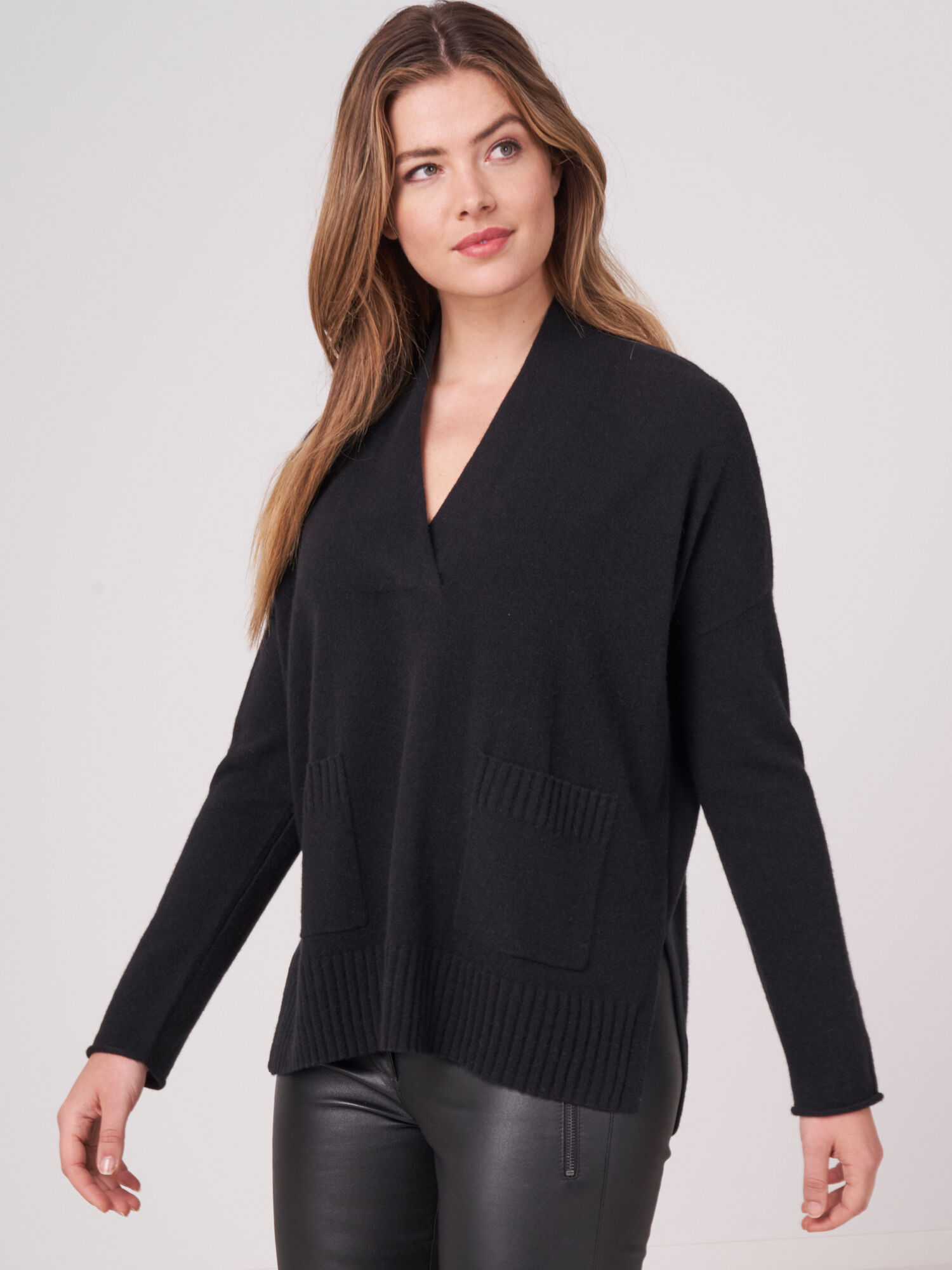 V-neck sweater with pockets and side slits