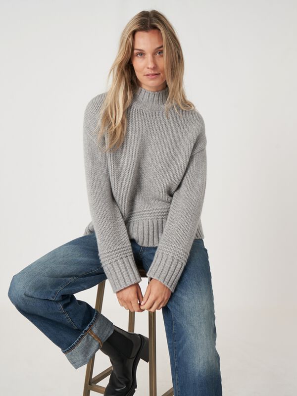 Stand collar sweater with ribbed hem with fancy knit details image number 0