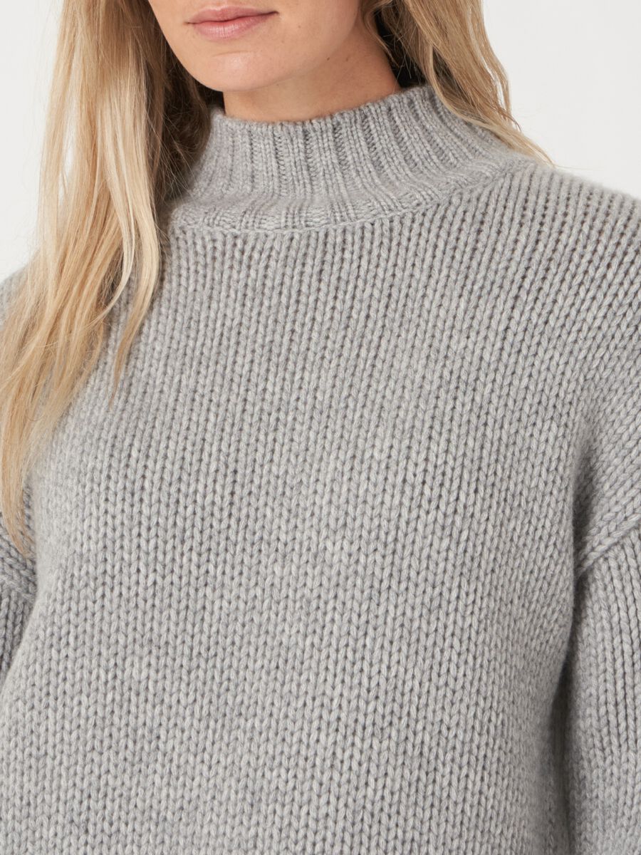 Stand collar sweater with ribbed hem with fancy knit details