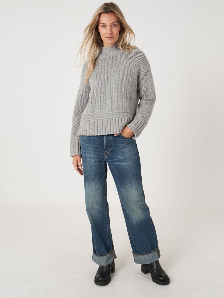 Stand collar sweater with ribbed hem with fancy knit details