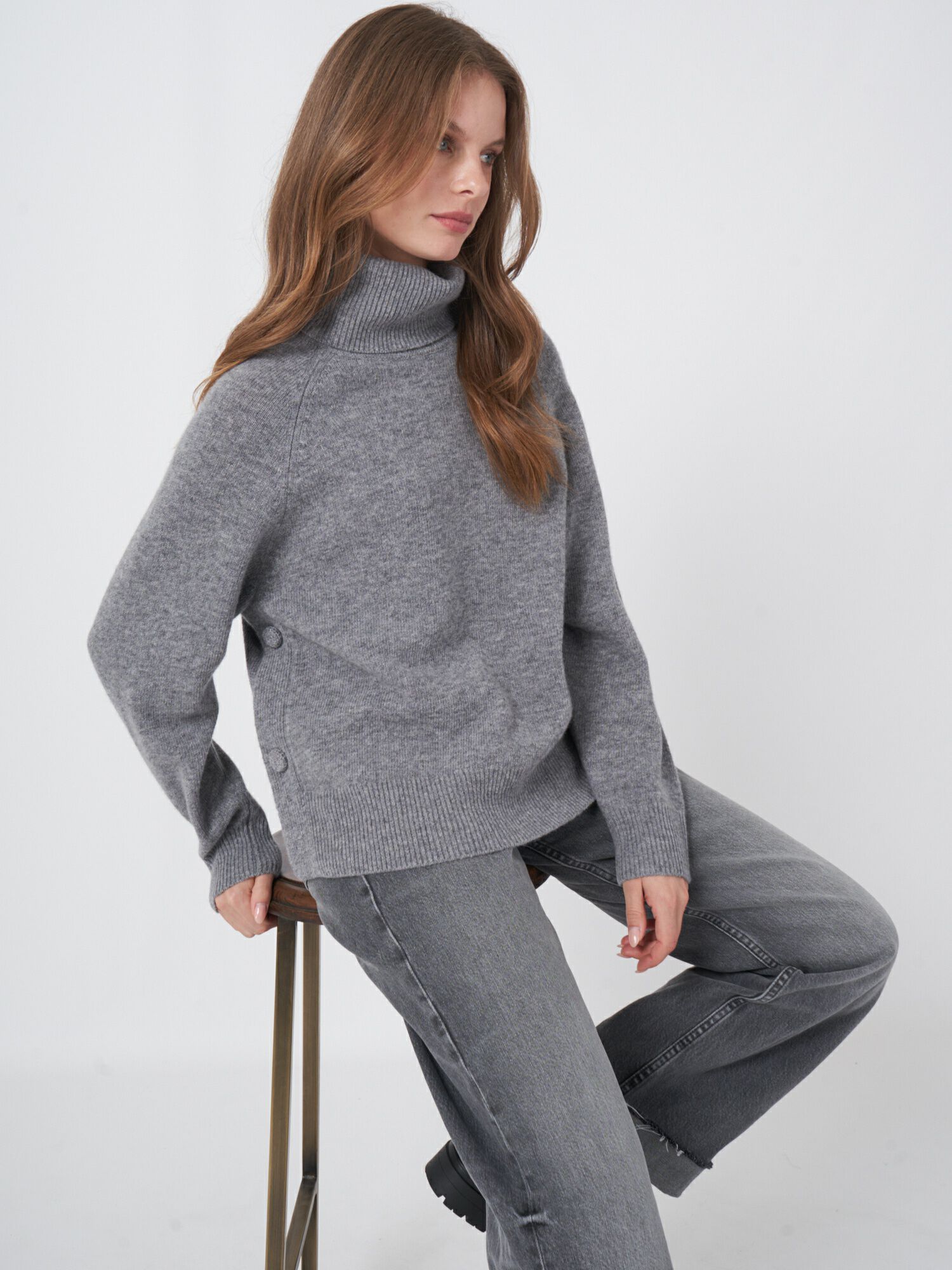 Turtleneck sweater with buttoned sides