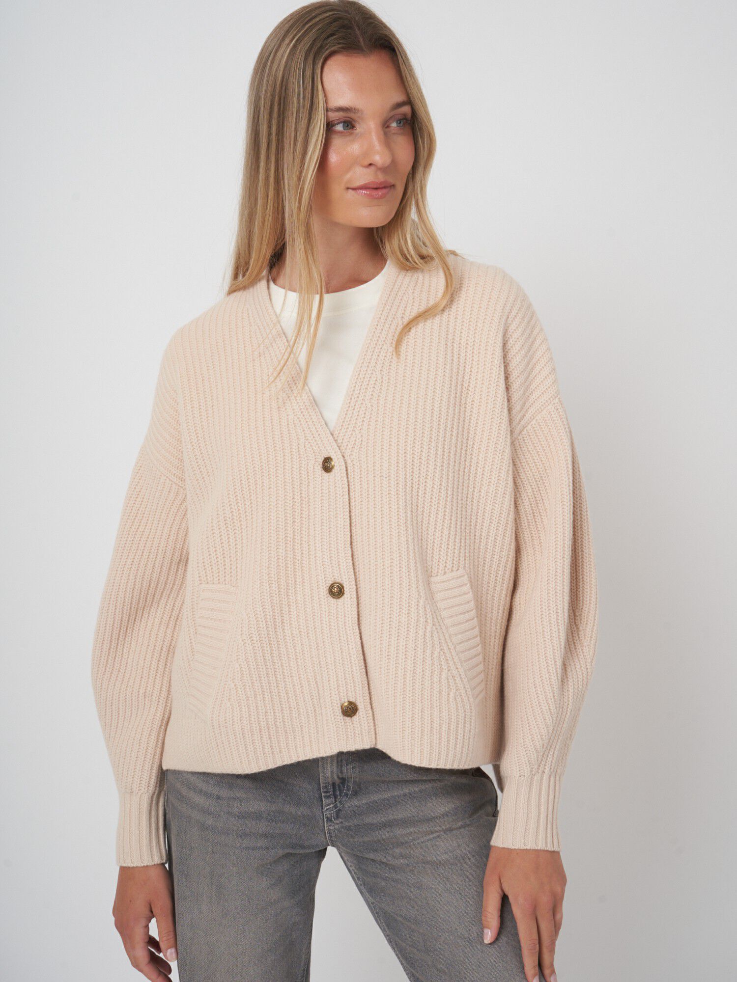 Oversized v-hals vest met functionele zakken afbeelding