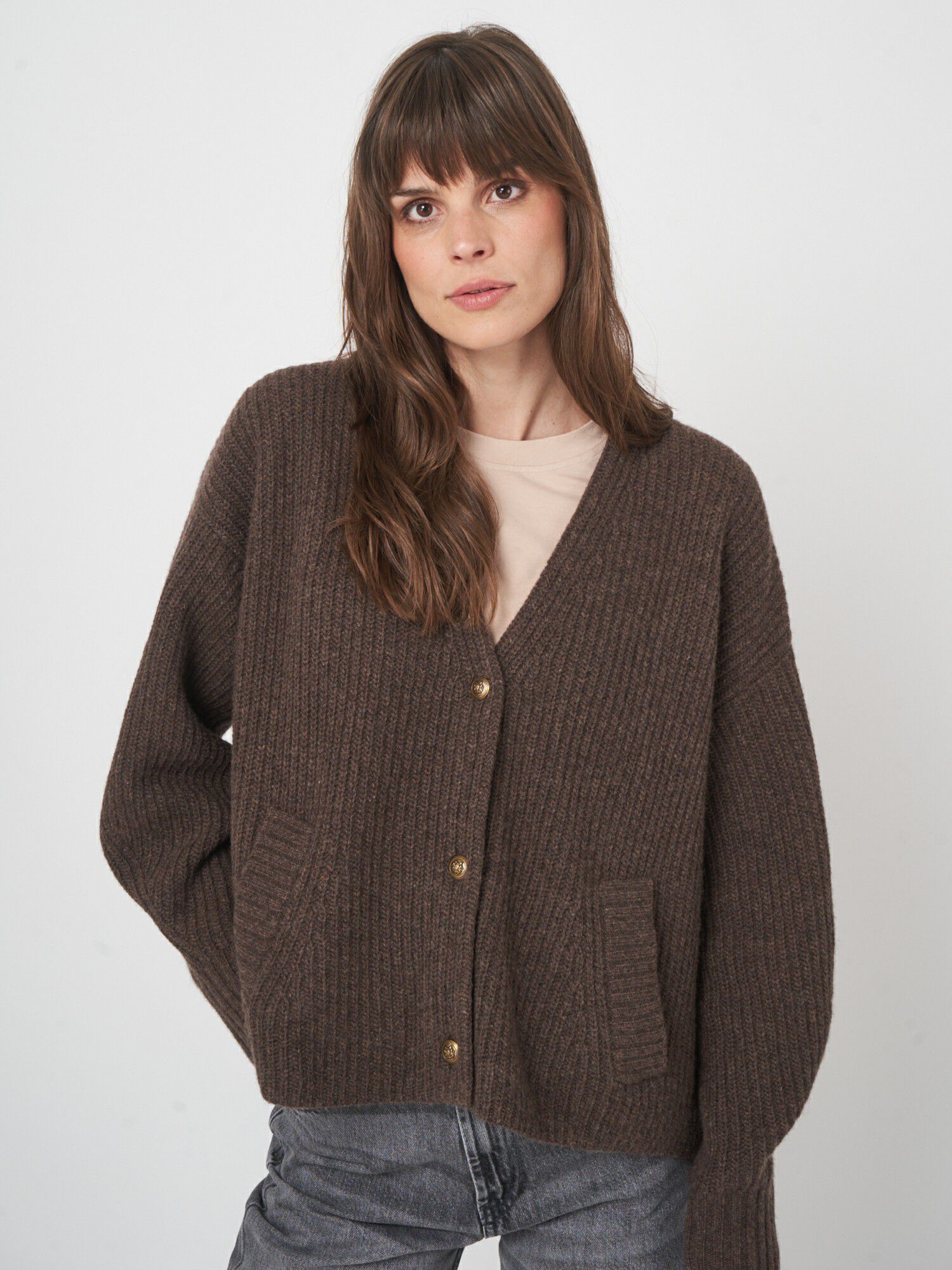 Oversized v-hals vest met functionele zakken afbeelding