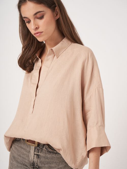 Oversized linen blouse with polo neck
