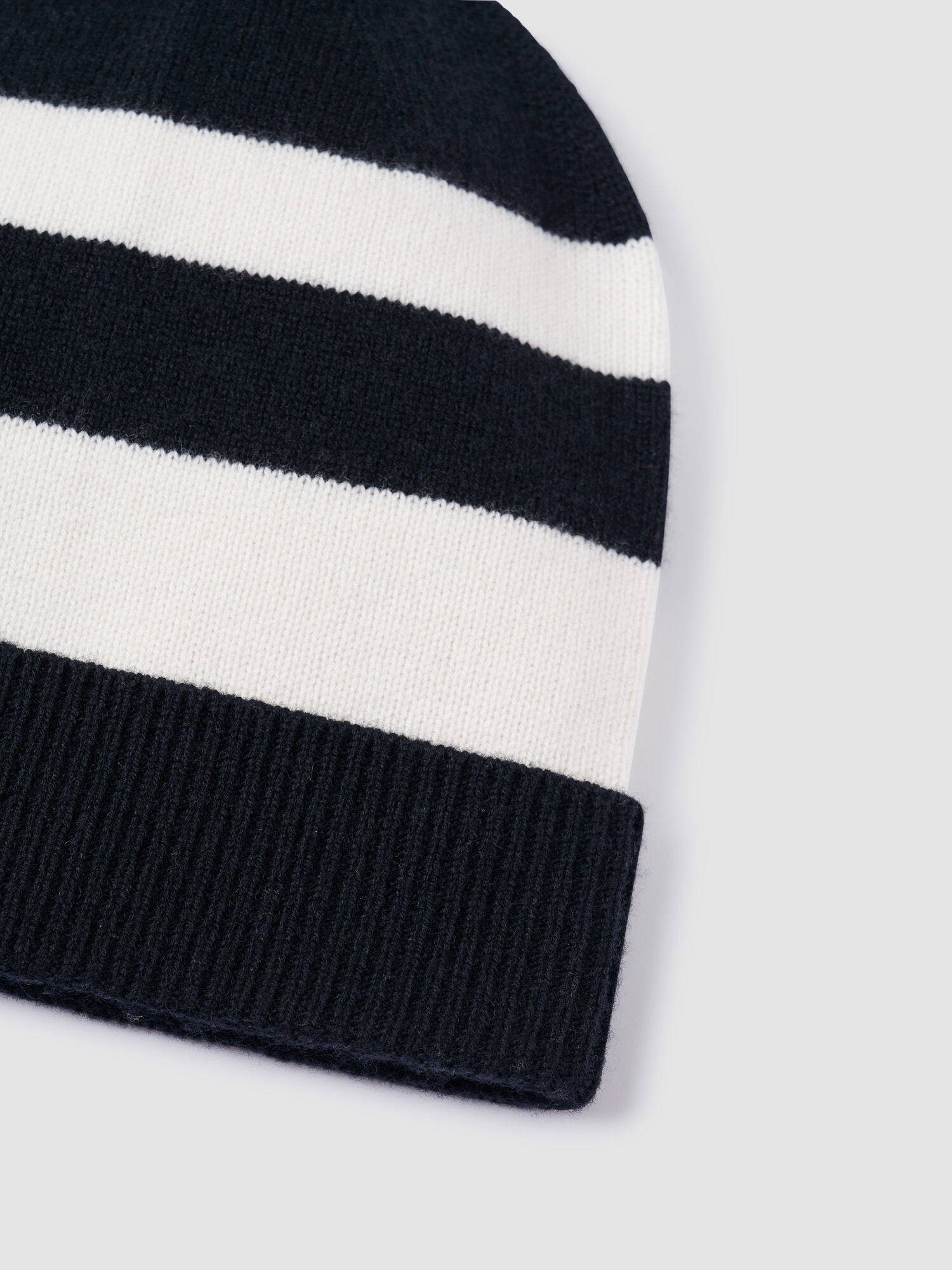 Cashmere blend knitted hat with pompom and stripes