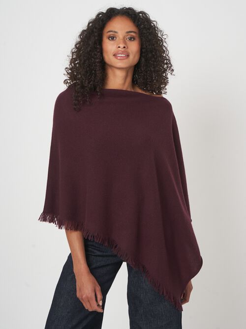 Fijngebreide poncho van organisch kasjmier met franjes