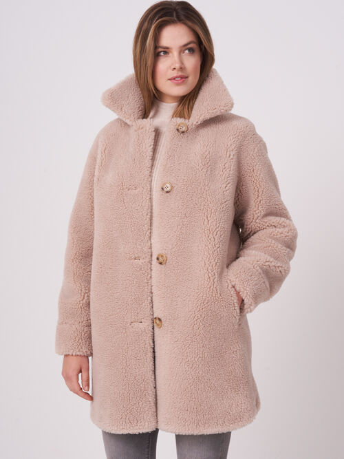 Mid length reversible faux shearling coat