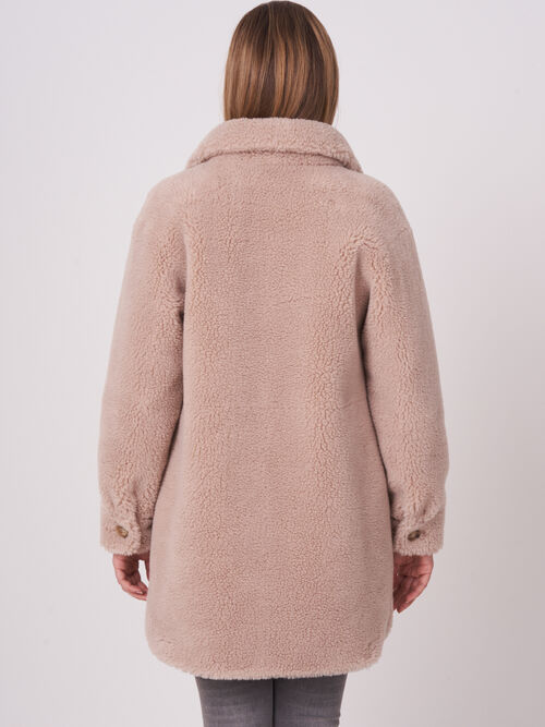 Mid length reversible faux shearling coat
