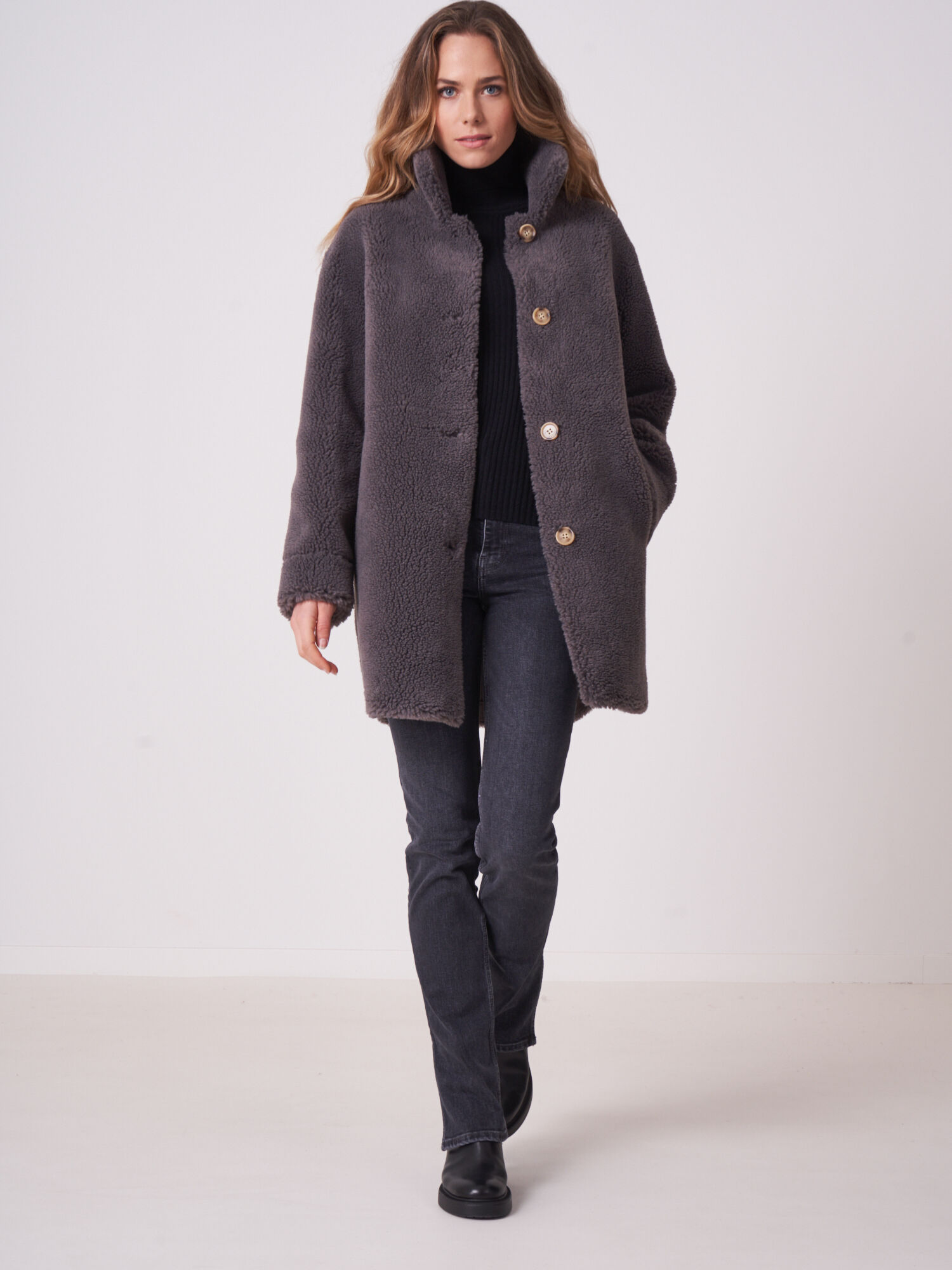 Mid length reversible faux shearling coat